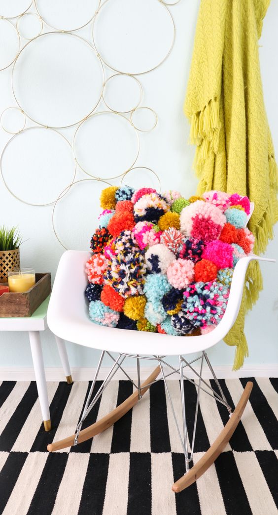 decorate with wool pompoms