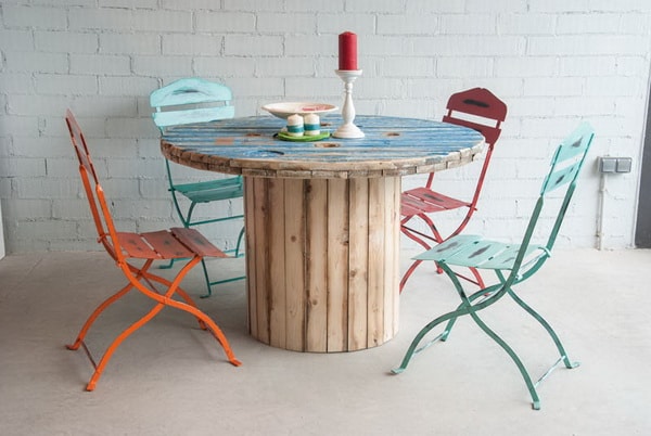 Informal dining room with table made from recycled cable reel