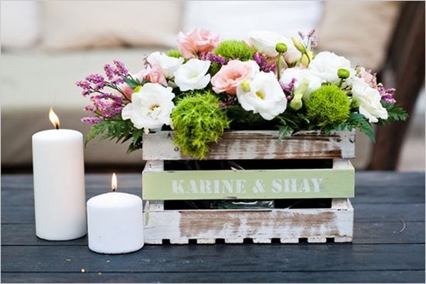 Flower arrangements in wooden boxes