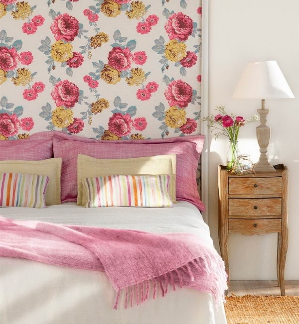 Wallpaper with flowers as bed headboard