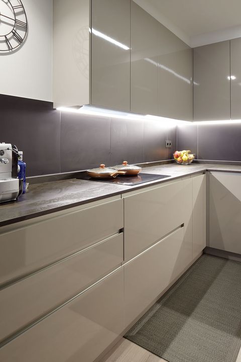 modern design kitchen with lacquered furniture in grey tones
