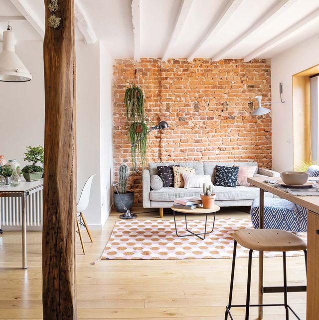 open spaces with exposed brick and wooden beams