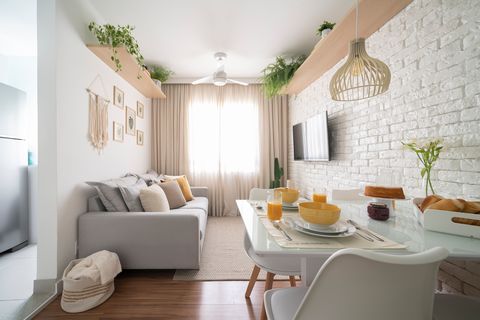 apartment decorated in white tones with macramé details