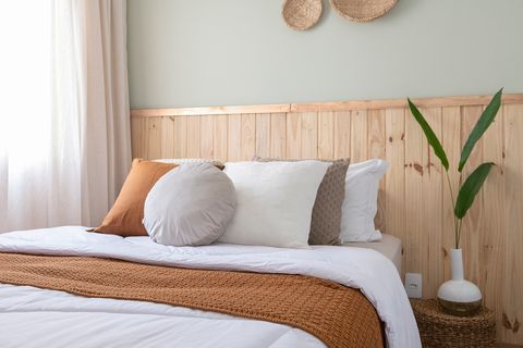 bedroom with wooden headboard