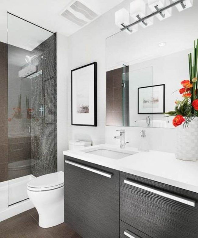 Small bathrooms are expanded with large mirrors and white walls, and see-through shower screens