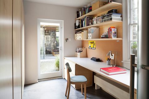 office with desk and open wooden shelves