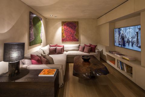 entertainment room with wooden coffee table and modern wall paintings