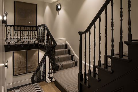 staircase with handrail from the 1940s painted in black