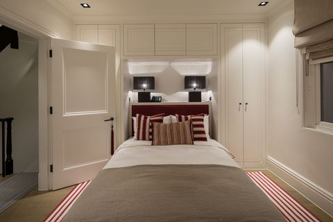 guest bedroom with red headboard