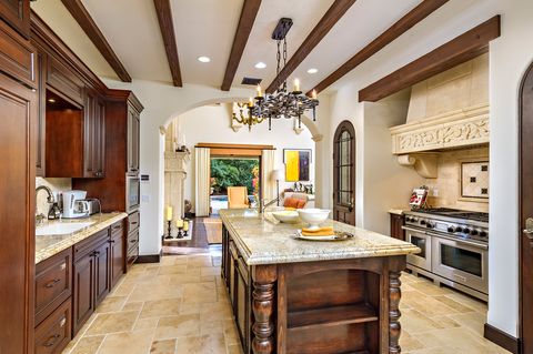 kitchen with central island in classic Tuscan style