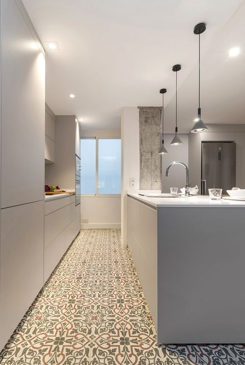 modern kitchen designed in grey and hydraulic floor