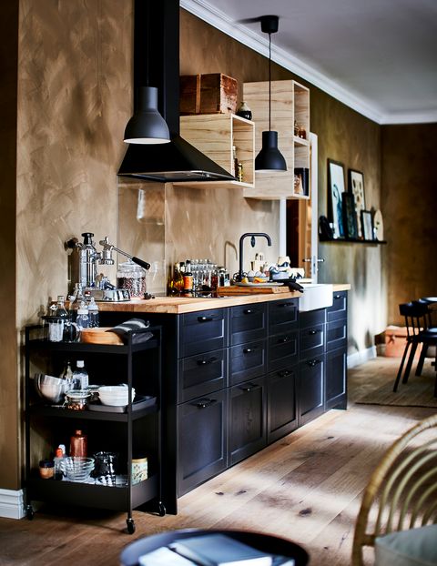 open kitchen decorated in black with wooden worktop from the new ikea 2021 catalogue