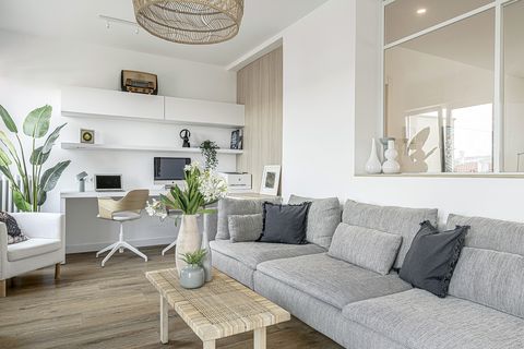 white floor and modern living room with grey sofa and work and study area