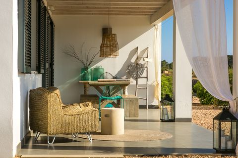 porch with natural fiber furniture