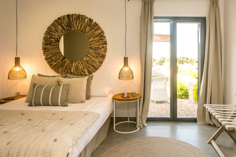 Mediterranean style bedroom decorated in earth tones