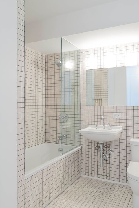minimalist bathroom decorated with mini tiles in white