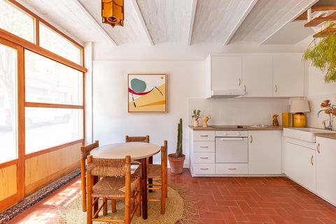 open kitchen with dining area decorated with natural fiber pieces
