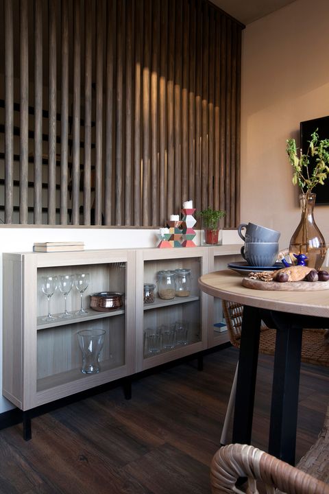 wooden sideboard with dishes in the dining room