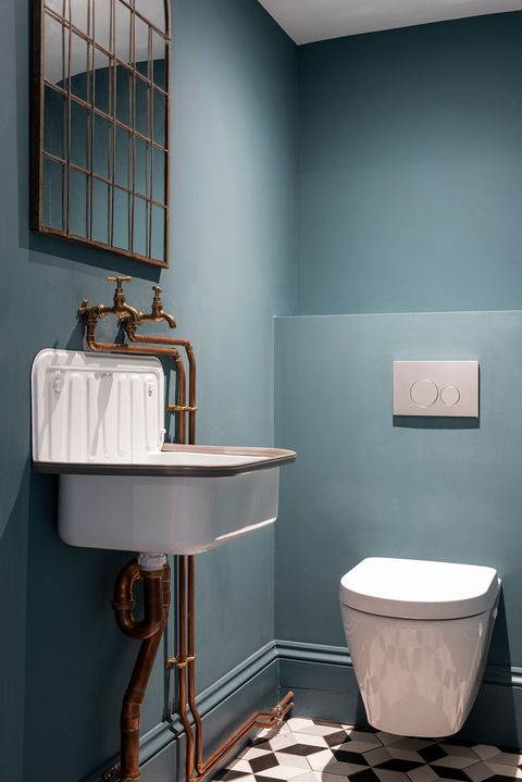 industrial style toilet with blue walls