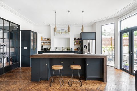 open kitchen with central island and wooden worktop
