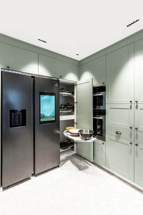 dusty green kitchen cabinets with built-in appliances