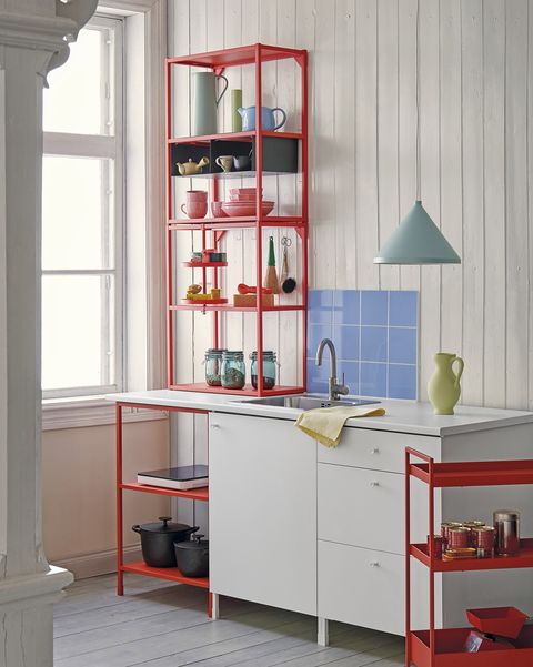 modern white kitchen with red shelving