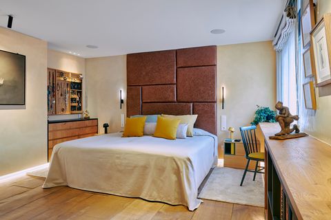 bedroom with leather upholstered headboard