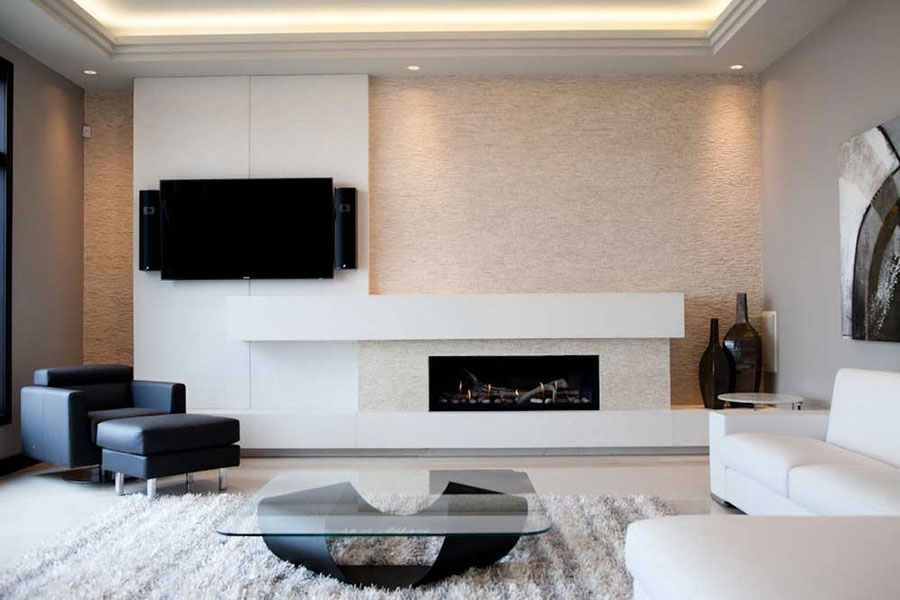 Ideas for furnishing a living room with a fireplace with a modern design n.12