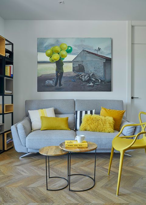 modern gray sofa with mustard toned cushions