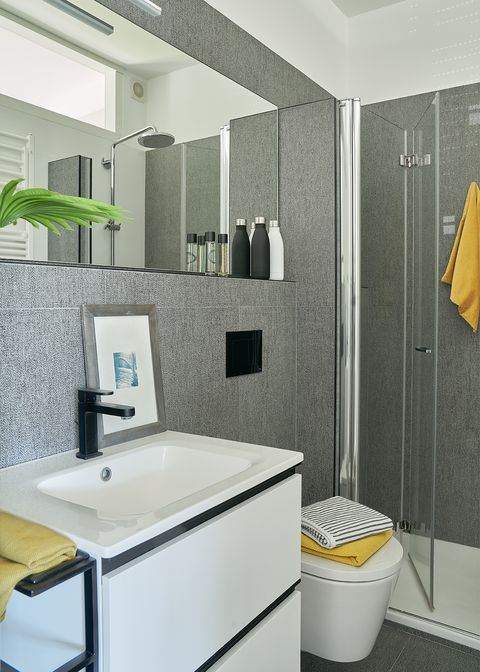modern bathroom with shower decorated in gray