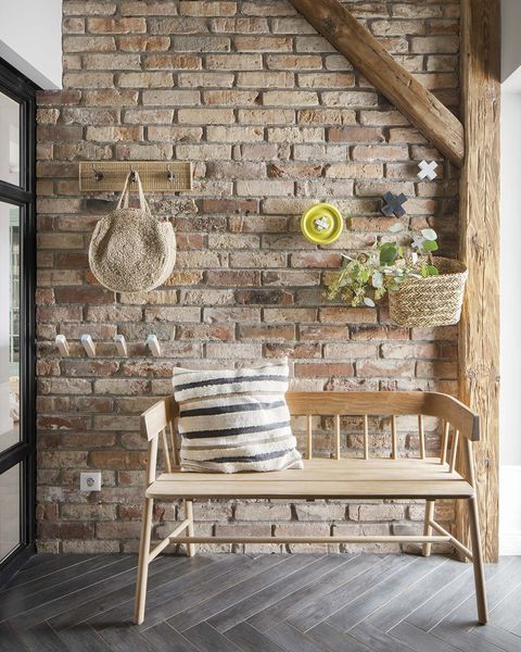 a nordic style country house hallway with brick wall