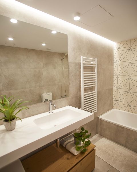 single-family house project by laiaubia studio bathroom with bathtub and flown washbasin